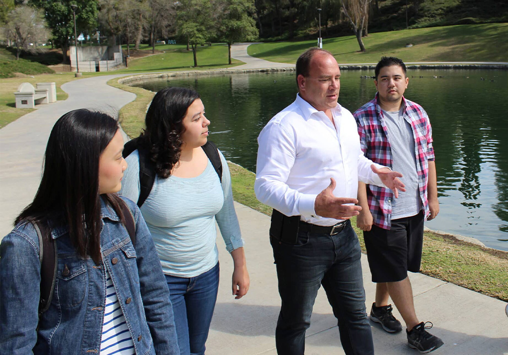 San Bernardino County Supervisor Curt Hagman walking in the park, talking to voters