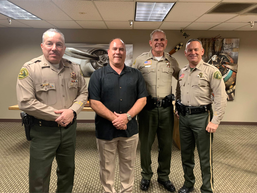 San Bernardino County Supervisor Curt Hagman poses with law enforcement officers